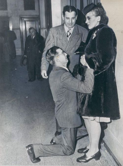 A man begging for his wife’s forgiveness inside Divorce Court. Chicago, 1948